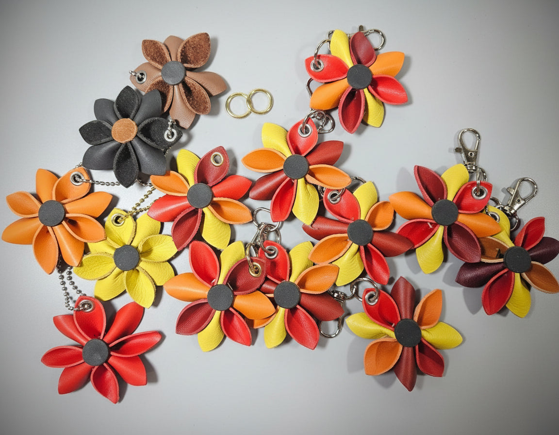 Colorful flower-shaped keychains on a dark surface
